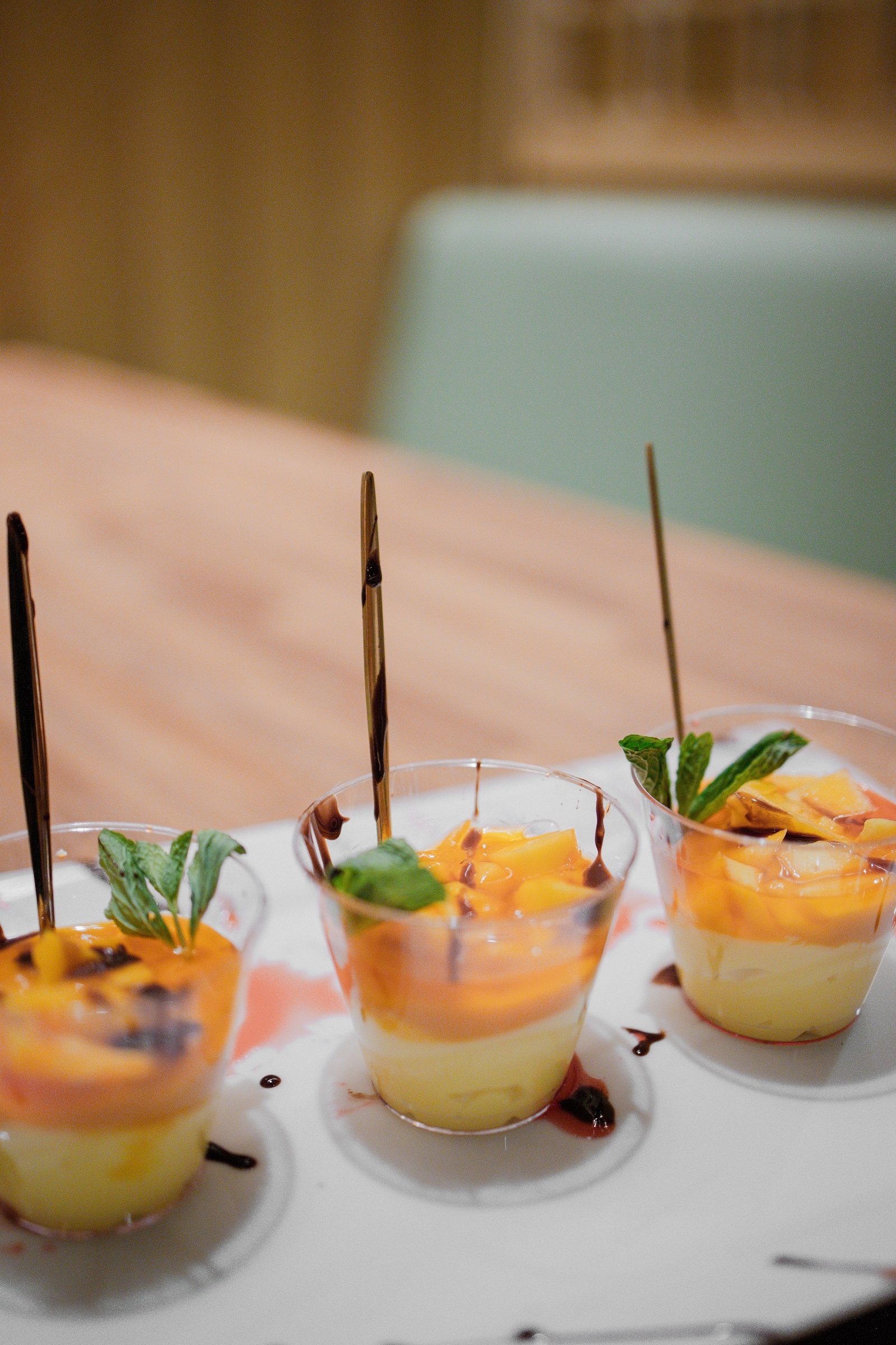 Layered mango dessert cups with mint